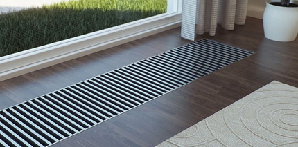 Chauffage électrique d'une maison privée avec un convecteur intégré au sol Chauffage électrique d'une maison privée