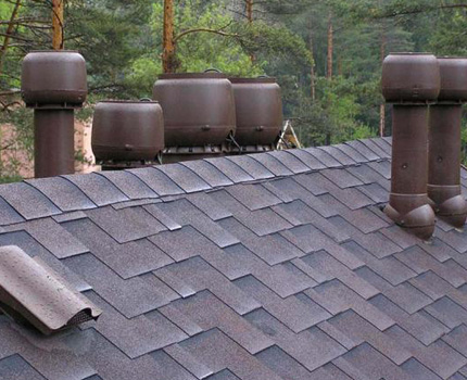 Ventilation ducts and aerators on the roof of a private house Ventilation outlets