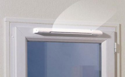Supply unit on a plastic window frame Supply unit above the window