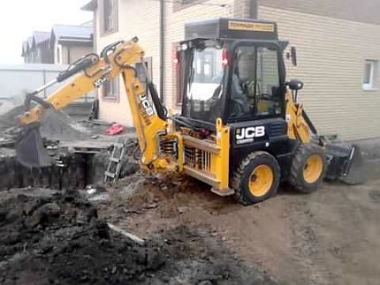 Digging a hole by an excavator Digging a hole by an excavator
