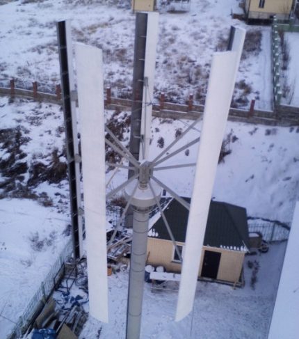 Vertical wind generator on a wooden mast Vertical wind generator on a wooden mast