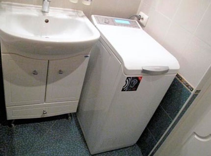 Installing a vertical model of a washer in the bathroom Vertical washer in the bathroom