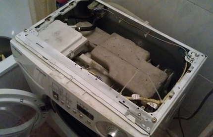 Removing the top panel of the washer