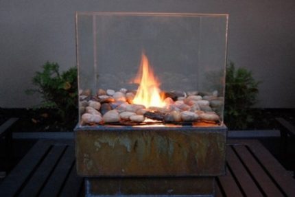 Homemade fireplace with burning biofuel Ecocamine at work