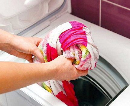 Modifications of washing machines Electrolux front and top loading Loading laundry into a vertical type washing machine