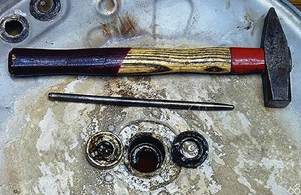 Knocking out a bearing with a hammer Knocking out a bearing with a hammer