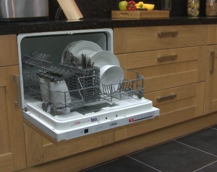 The compact dishwasher takes up a minimum of space Compact built-in model