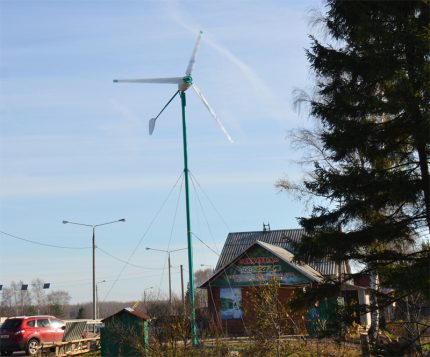 Wind turbine near a private house Windmill EnergyWind