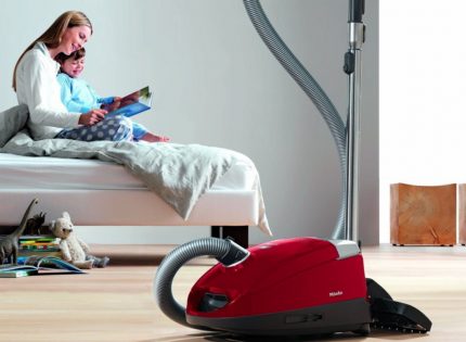 Appearance of brand household vacuum cleaners Mile technique in the living room