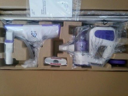Disassembled vacuum cleaner in a package