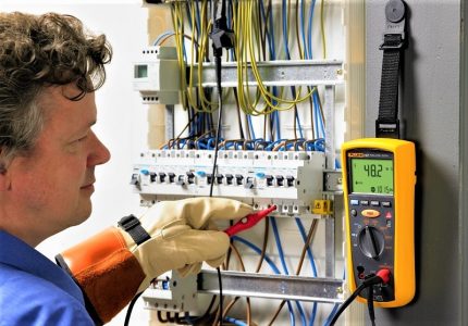Testing the operation of devices in the electrical panel Testing electricians in the shield