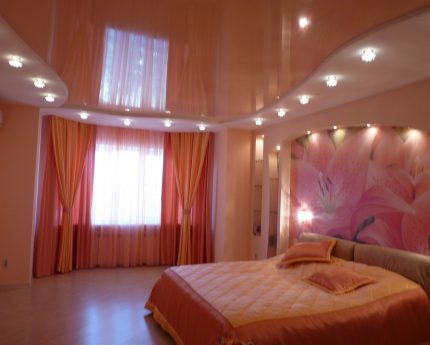 Bedroom interior with glossy stretch ceiling Stretch ceiling in the bedroom