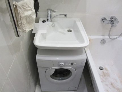 Water lily sink with drain and mixer on one side Water lily with angled mixer