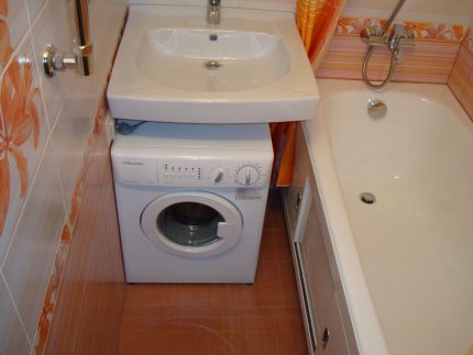 Washing machine with a water lily under the sink Electrolux washbasin under the sink