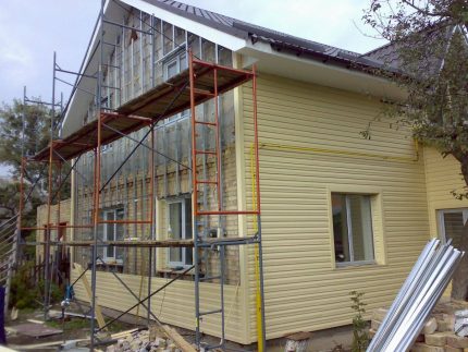 Facade cladding Installation of the facade in early spring