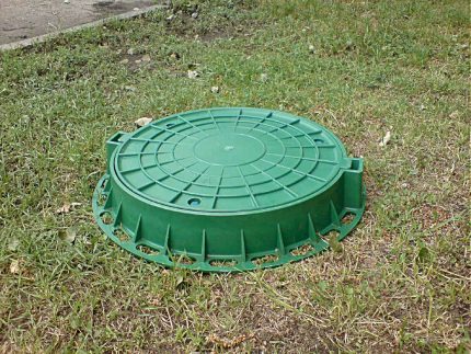 Plastic sewer cover Green plastic sunroof on the ground