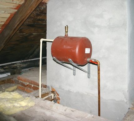 The tank is installed in the attic of a private house Placement of expansion tanks