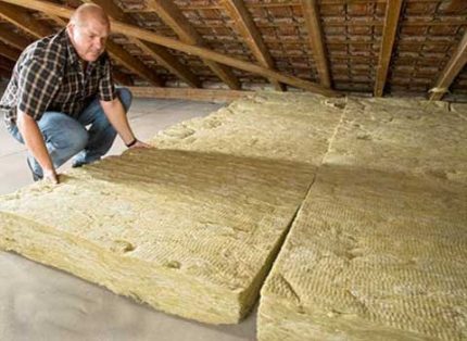 Laying mineral wool slabs in the attic Mineral wool