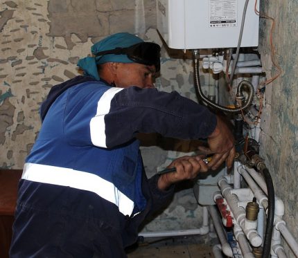 Gasman works with equipment Gasman works with equipment