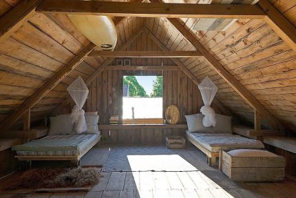 Uninsulated attic in a country house Summer attic in the cottage