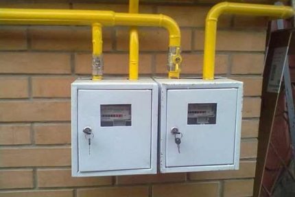 Gas flow meters on the facade of a house Gas meters