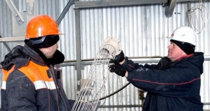 Workers replace bag filter Workers replace bag filter