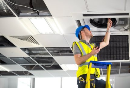 Worker checks ventilation Worker checks ventilation